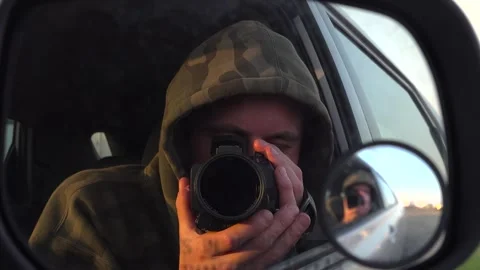 Self Portrait of Videographer Filming Through Vehicle Side Mirror Stock Footage 345165351