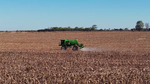 Self-propelled agricultural sprayer applying liquid fertilizer or herbicide.. Stock Footage 345931691