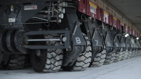 Self propelled modular transporter for moving extremely heavy loads Stock Footage 345082312