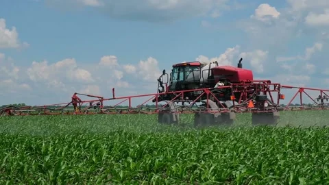 Self-propelled sprayer applies crop protection products to corn Stock Footage 166616570