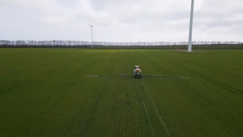 Self-propelled Sprayer Machine Working in Green Field, Aerial View Video stock 331939549