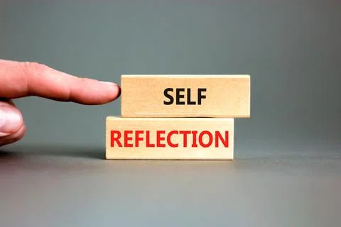 Self reflection symbol. Concept word Self reflection typed on wooden blocks.. Stock Photos