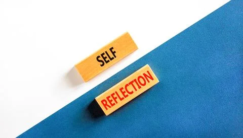 Self reflection symbol. Concept word Self reflection typed on wooden blocks.. Stock Photos