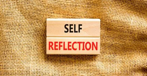 Self reflection symbol. Concept word Self reflection typed on wooden blocks.. Stock Photos