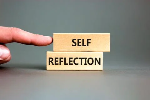 Self reflection symbol. Concept word Self reflection typed on wooden blocks.  Stock Photos