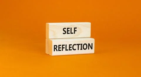 Self reflection symbol. Concept word Self reflection typed on wooden blocks.. Stock Photos