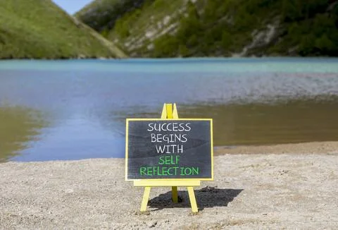 Self reflection symbol. Concept words Success begins with self reflection o.. Stock Photos