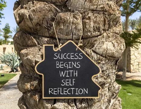 Self reflection symbol. Concept words Success begins with self reflection o.. Stock Photos