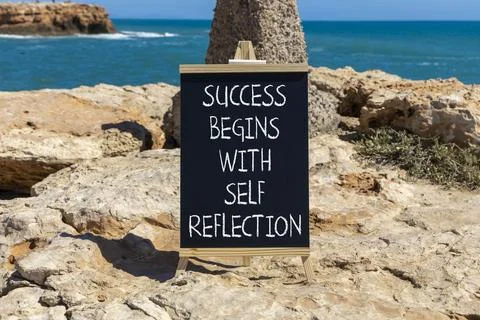 Self reflection symbol. Concept words Success begins with self reflection o.. Stock Photos