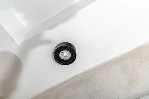 Self-replacement of a burnt-out LED bulb, black surface-mounted fixture sus.. Stock Photos