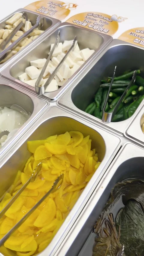 Self-Service Korean Banchan Buffet with Pickled Radish and Kimchi Stock Footage 343599710