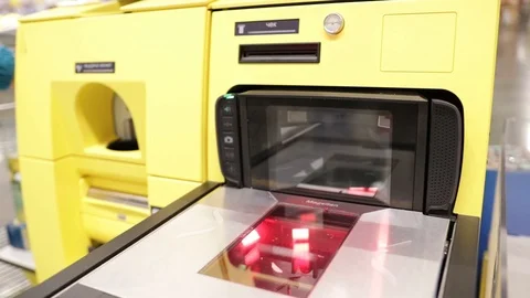 Self-service machine with a touch screen scanning a bar code from a smartphone i Stock Footage 119361348