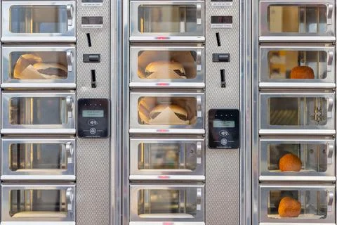 Self service ordering window with burger sandwiches of a Dutch snackbar 库存照片