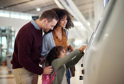 Self service, technology and travel with mixed family in airport for check in Stock Photos