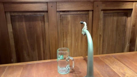 Self serving beer tap automatically moving on a bar counter Stock Footage 318680133