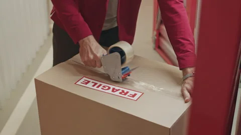 Self Storage Client Sealing Box with Adhesive Tape Stock Footage 259826455