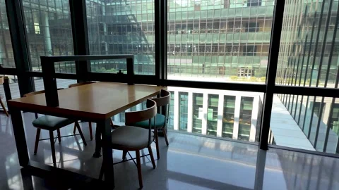 Self-study desk in a library, office or workspace by large windows Vídeo Stock 295252240