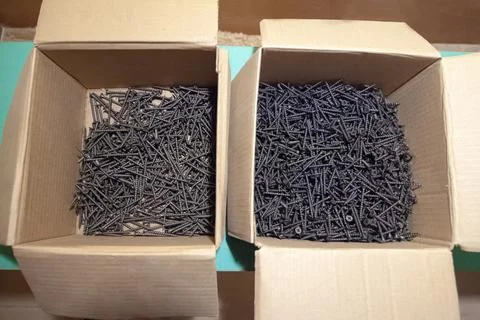 Self-tapping screws in a box Stock Photos