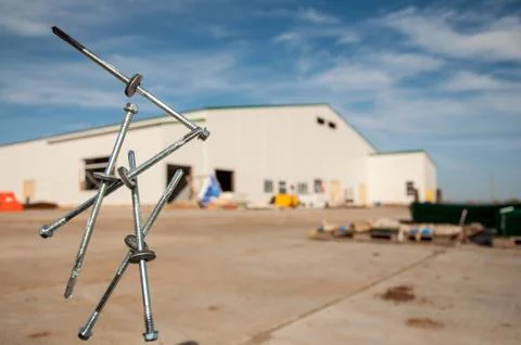 Self-tapping screws falling into the air for sandwich panels. Stock Photos