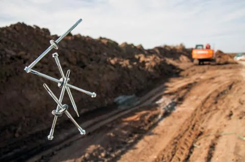 Self-tapping screws falling into the air for sandwich panels. Stock Photos