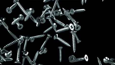 Self-tapping screws fly up and fall down. Filmed on a high-speed camera at 1000 Stock Footage 307932132