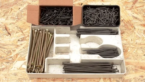 Self-tapping screws on a wood plate Stock Footage