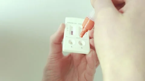 Self-test kit for COVID-19 and influenza in a real home environment. Stock Footage 328348276