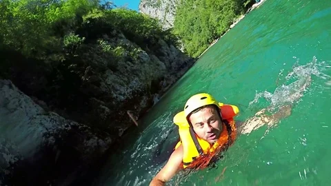 Selfie with action camera Gopro while jumping in White water during rafting. Stock Footage 72300603