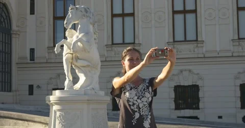 Selfie on the background of the horse statue Stock Footage 67523293