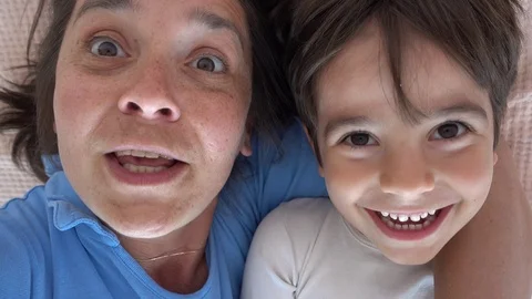 Selfie Comic mother telling ghost story to her son, child Stock Footage 89661790