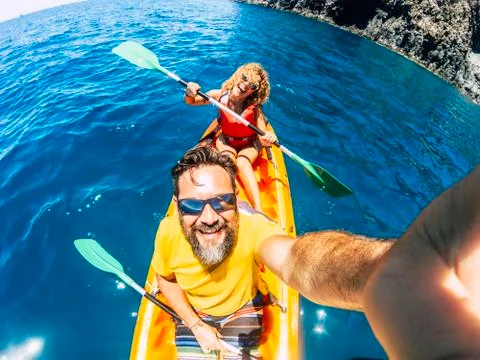 Selfie couple with top vertical point of view - happy active adult people enj Stock Photos