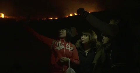 Selfie in front of a Brush Fire at Night Video stock 73308930