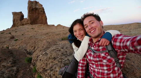 Selfie - Happy couple taking self portrait hiking Stock Footage 37679229