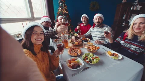 Selfie of happy family at table celebrating Christmas, view from phone. Video Stock Footage