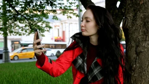 Selfie in the park Sitting on the grass Stock Footage 76478391
