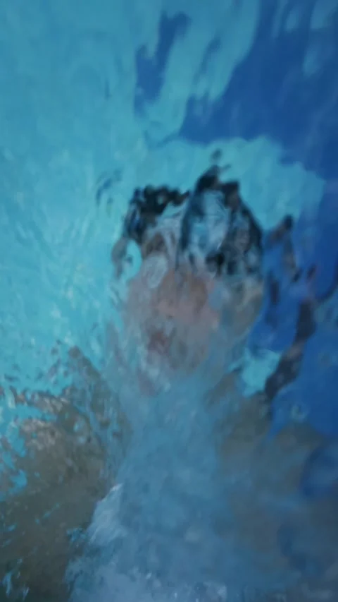 Selfie POV View of Man Falling Backward into Swimming Pool with Water Splash at Stock Footage 337954345