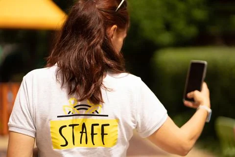 Selfie taking while working as a staff member Foto stock