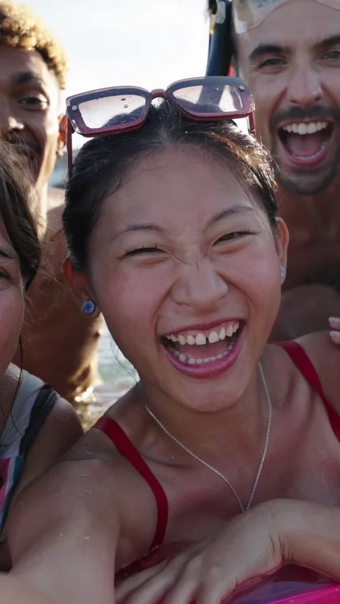 Selfie time. Group of cheerful multiracial friends in swim wear and diving Video stock 269543590