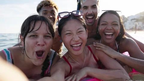 Selfie time. Group of cheerful multiracial friends in swim wear and diving Video stock 270254524