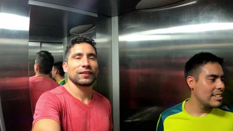 Selfie of two friends inside an elevator after exercising Stock Footage 195129914