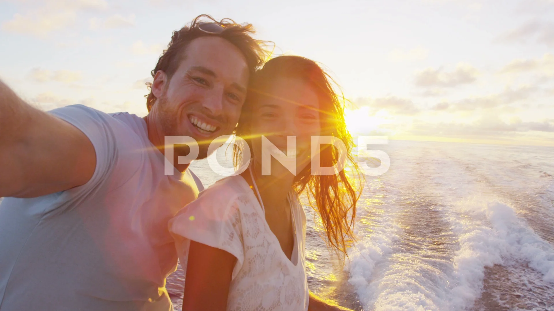 Selfie video - Romantic couple on sunset cruise ship over the ocean