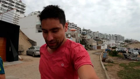 Selfie video of two men running on the beach Stock Footage 195128924