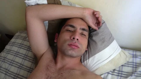 Selfie of a white man looking at the camera after a night out with a hangover 库存影片 161936809