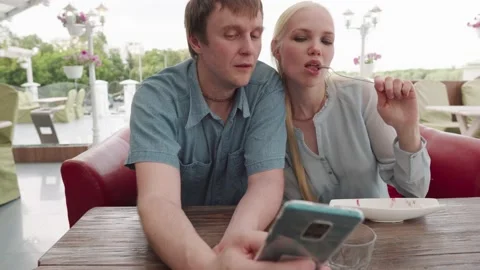 Selfie of a young couple in a cafe. Stock Footage 133314093