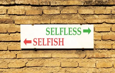 Selfless instead selfish words symbol. Concept words Selfless Selfish on be.. Fotos de archivo