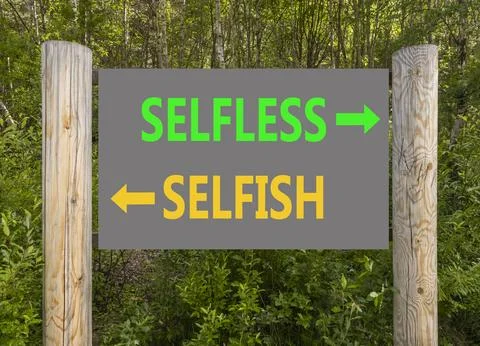 Selfless instead selfish words symbol. Concept words Selfless Selfish on be.. Fotos de archivo
