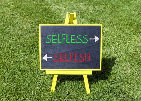 Selfless instead selfish words symbol. Concept words Selfless Selfish on be.. Fotos de archivo