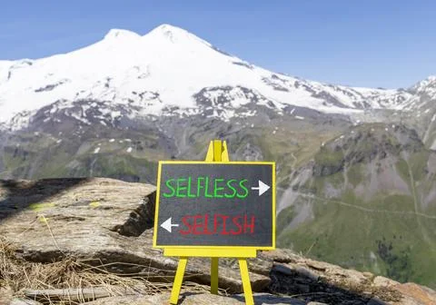 Selfless instead selfish words symbol. Concept words Selfless Selfish on be.. Fotos de archivo