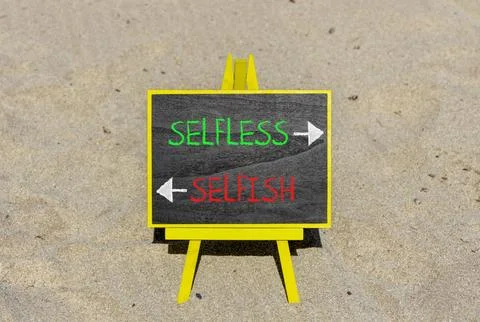 Selfless instead selfish words symbol. Concept words Selfless Selfish on be.. Fotos de archivo