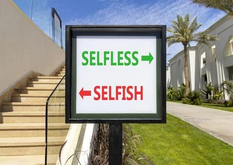 Selfless instead selfish words symbol. Concept words Selfless Selfish on be.. Fotos de archivo